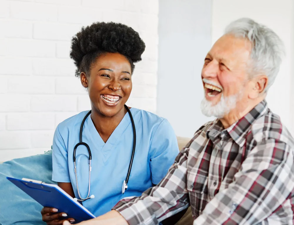 Healthcare professional supporting an older adult patient