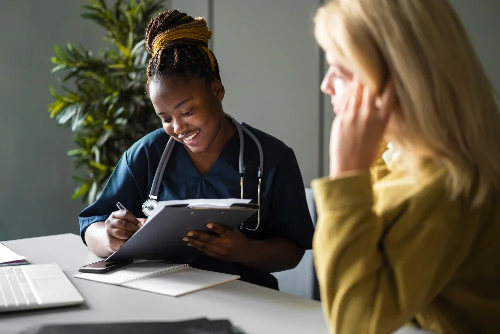 Healthcare provider discussing health and wellness with a patient during a consultation