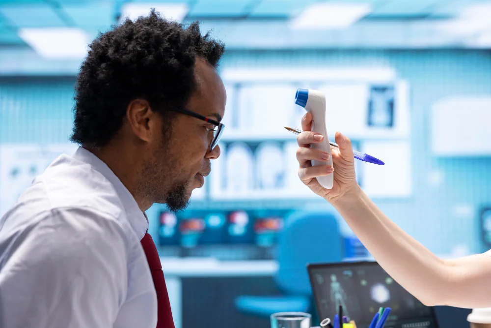 Healthcare provider completing a broader health assessment with a patient