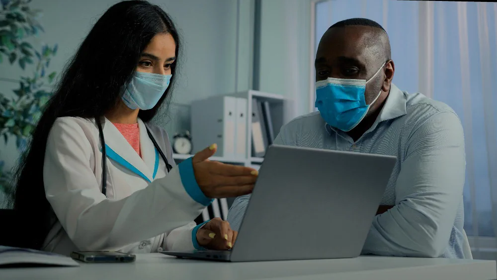 Healthcare professionals reviewing patient information during care planning