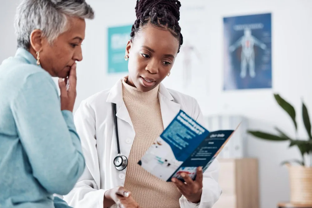 Healthcare provider explaining health risk assessment information to a patient