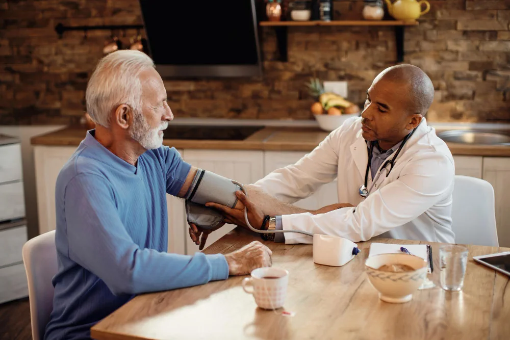 Healthcare provider checking a patient during a scheduled house visit