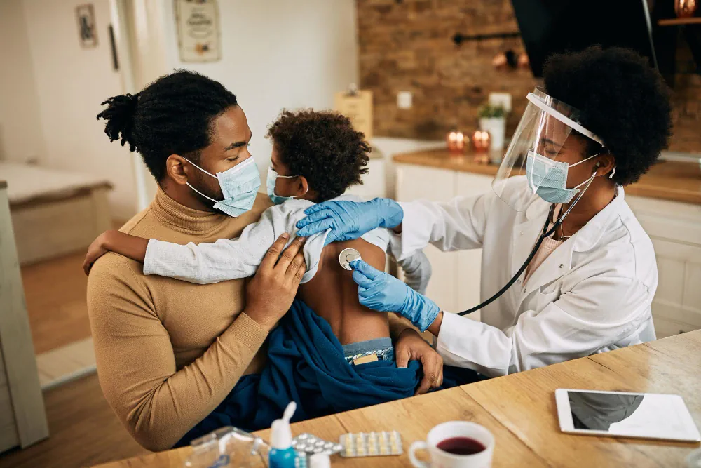 Healthcare provider administering a vaccination while a parent is present