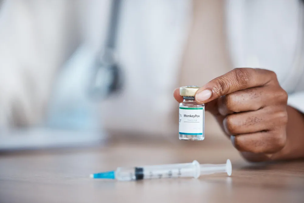 Vaccine vial and syringe prepared for immunization