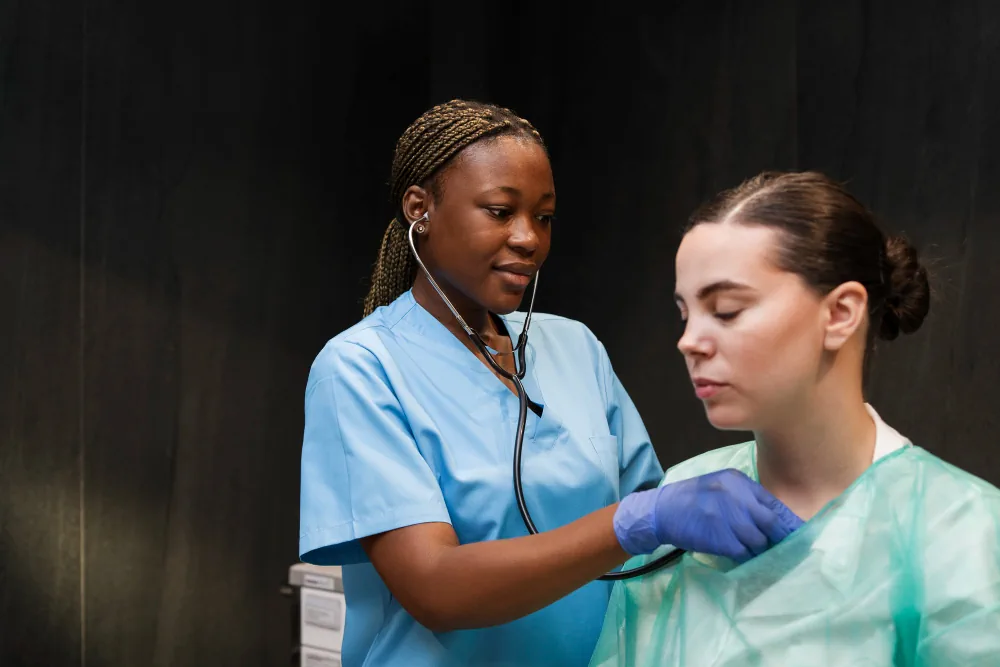 Healthcare support person assisting a patient during medical care
