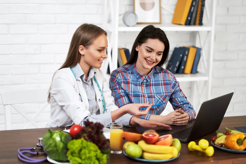 Healthcare professional reviewing healthy food choices with a client