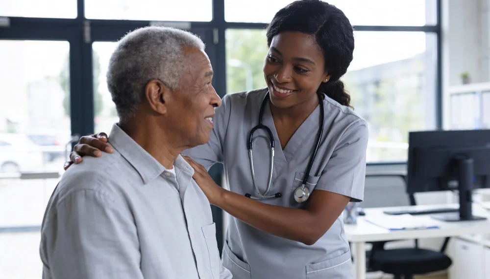 Healthcare professional supporting a patient during a preventive care visit