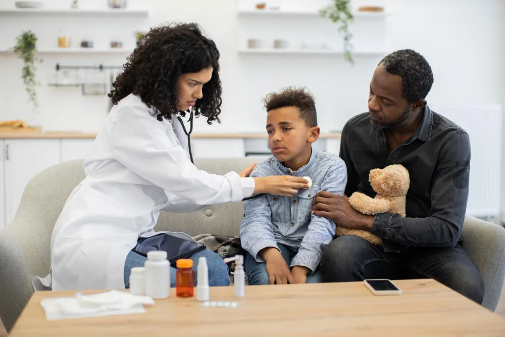 Healthcare provider speaking with a family during a consultation