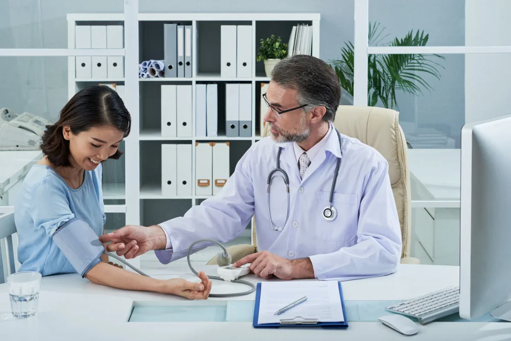 Healthcare provider discussing a routine medical checkup with a patient