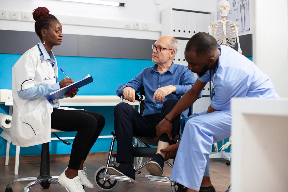 Healthcare team supporting a patient during a primary and preventive care visit