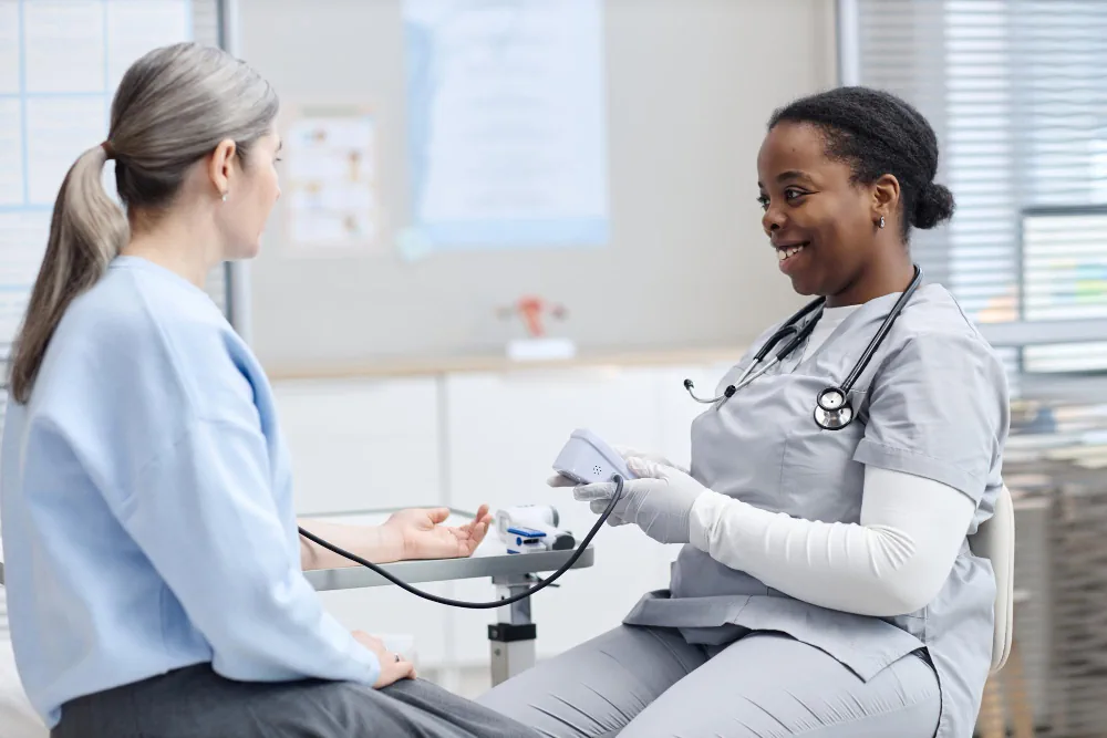Healthcare provider checking a patient's blood pressure