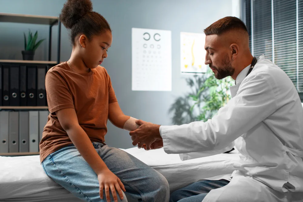 Healthcare provider checking a patient during a routine medical visit