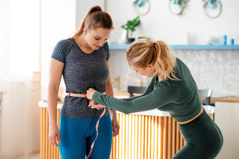 Waist measurement during a weight loss coaching progress review