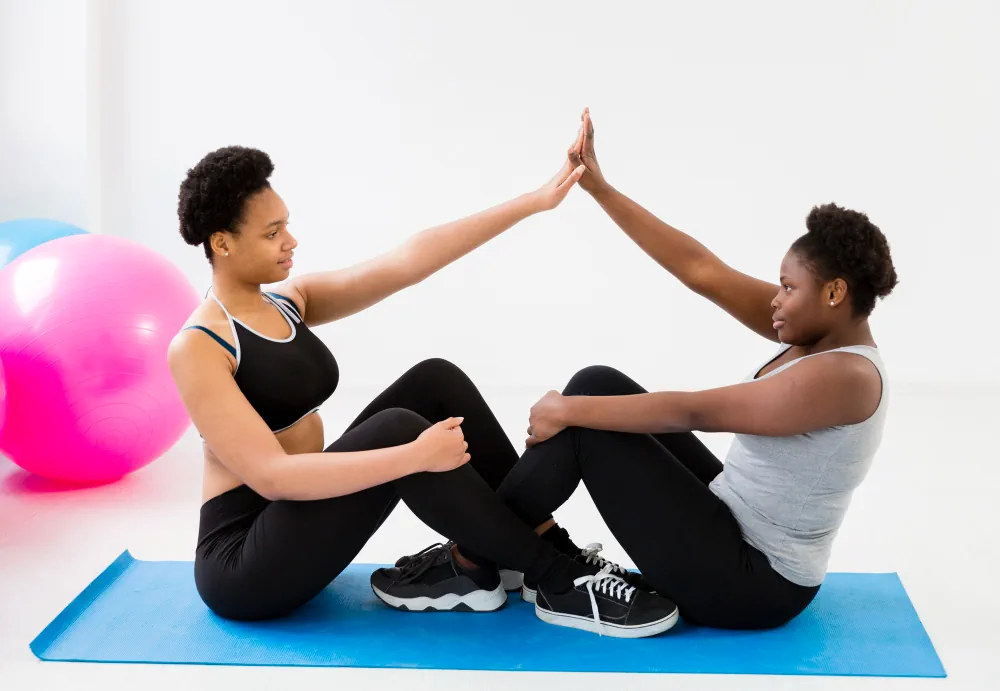Workout partners celebrating progress with a high five